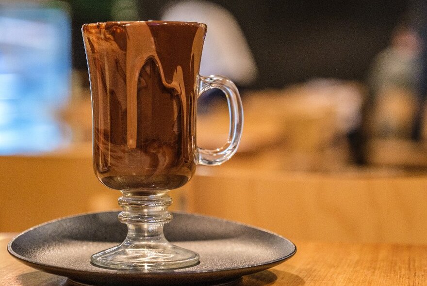 A glass mug filled with hot chocolate
