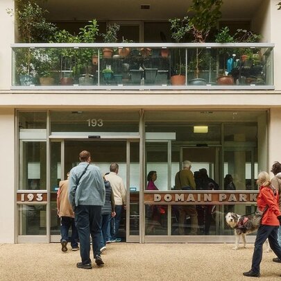 A tour walking through the open doors of Boyd's modernist Domain Street apartment building in South Yarra.