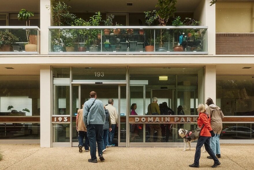 A tour walking through the open doors of Boyd's modernist Domain Street apartment building in South Yarra.