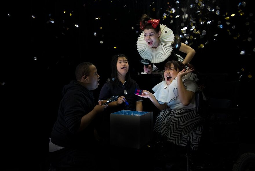 Characters performing on a dark stage with glitter falling, one character wearing an Elizabethan ruff.