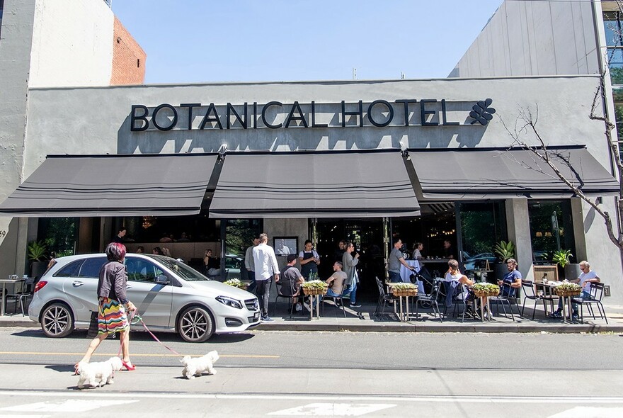 Cafe tables outside Botanical Hotel in Domain Road.