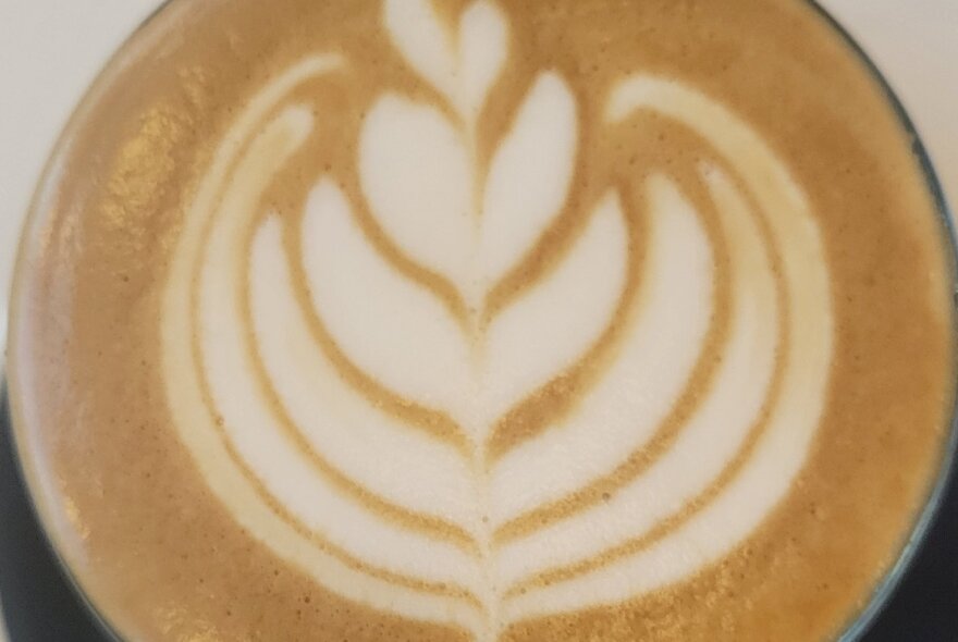Latte art on a glass of coffee.