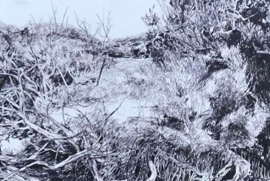 Artwork of thorns and earth on a cliffside.