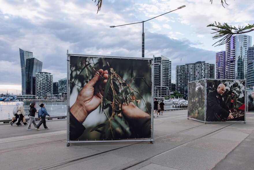 Large scale artworks depicting smoking ceremonies, outdoors at Melbourne's Docklands. 