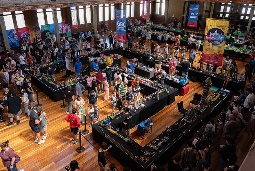 Crowded expo stands in the Royal Exhibition Building.