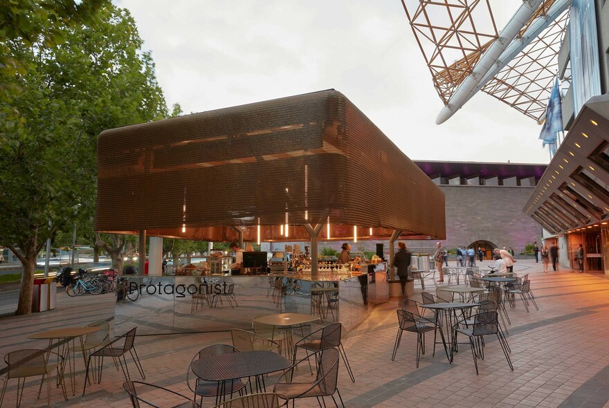 Protagonist cafe tables and chairs in the Arts Centre Melbourne forecourt.