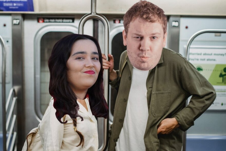 Two oversized cut-out faces of the performers in this show, superimposed onto the bodies of two people standing next to each other in a train carriage.