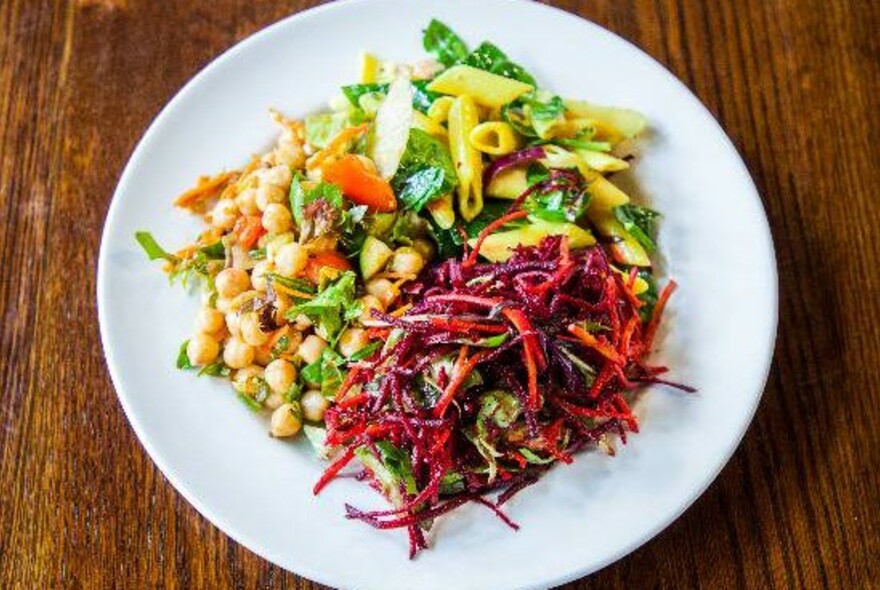 Vegetarian meal of chickpeas, beetroot salad and pasta.