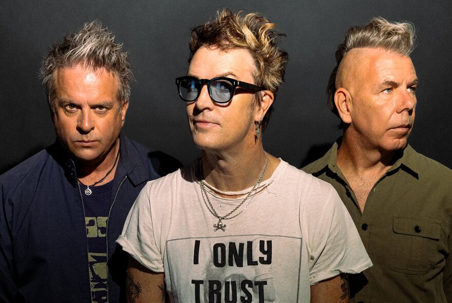 The three members of the bank The Living End, looking serious.