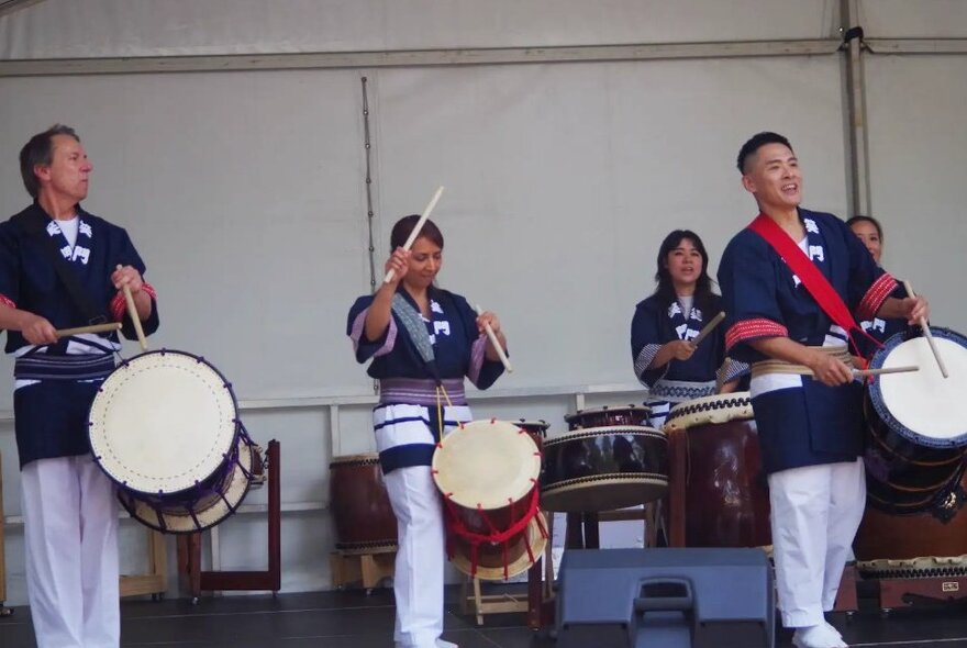 Traditional Korean drummers on stage.