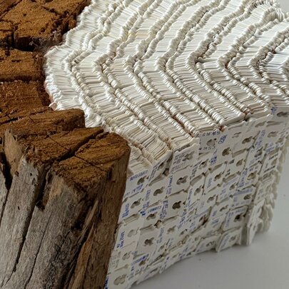 Wooden sculpture with white detail.
