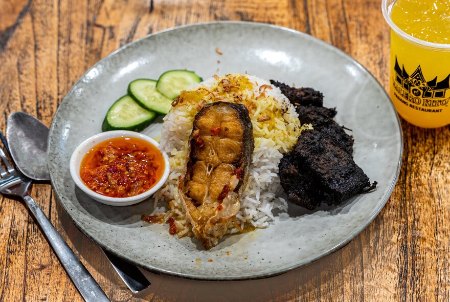 Plate of West Sumatran food with chillies, rice and meat.