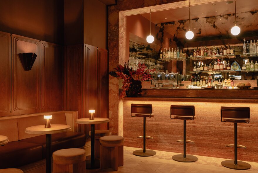 The softly lit interior of Bar Privé, an intimate cocktail bar located inside the heritage-listed former Melbourne safe deposit building.