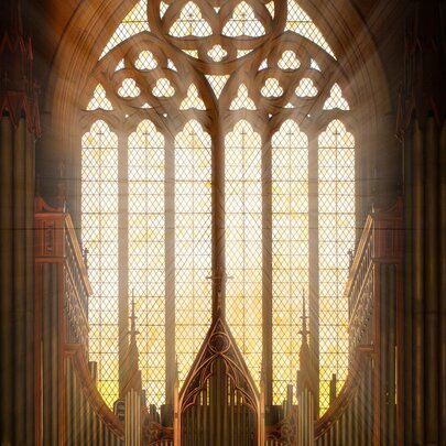 The interior of St Patrick's gothic cathedral, featuring towering stone arches and large, ornate stained glass windows, with the pipes of the organ visible in the lower half of the image.