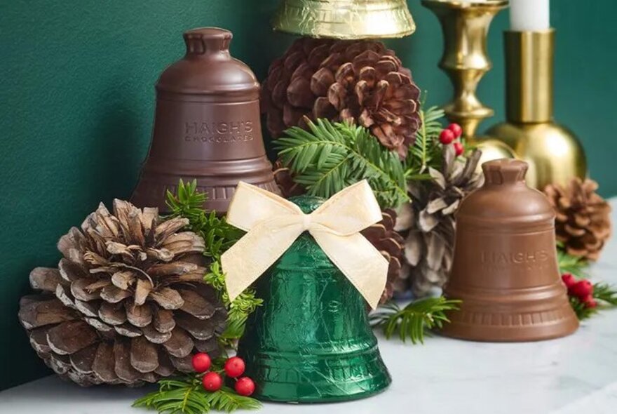 A display of chocolate bells and pinecones.