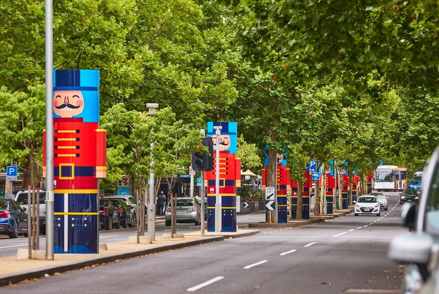 Nutcracker decorations in the centre of a street. 