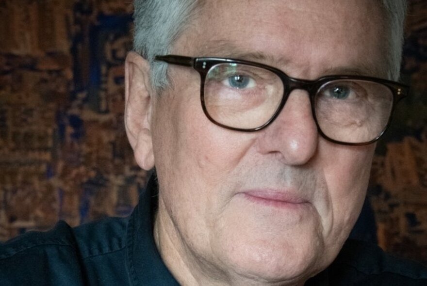 Journalist and author David Marr, wearing glasses, with short white hair.