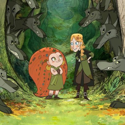 A still from the animated film Wolfwalkers, with a flame-haired girl standing next to another girl, surrounded by several grey wolves in a forest clearing. 