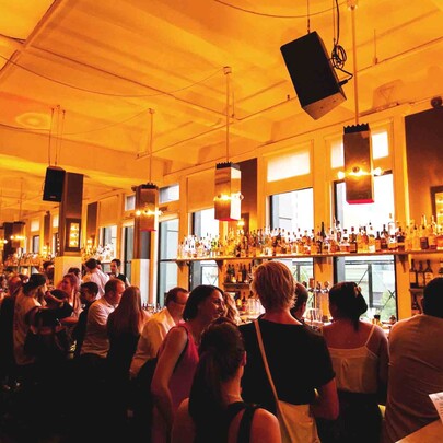 Crowd of people waiting to be served at the bar area of the Toff in Town.