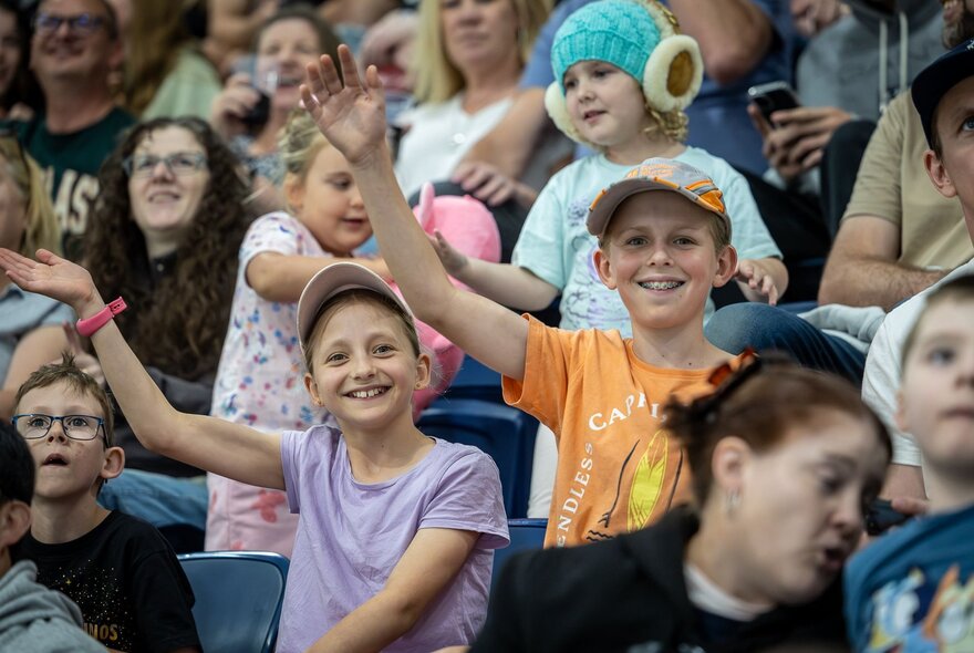 Fans in the crowd at an ice hockey game.