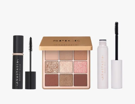 A beauty set of a nine shade pink eyeshadow palette a brow gel and mascara.