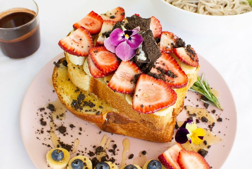 French toast topped with strawberries and oreo cookies