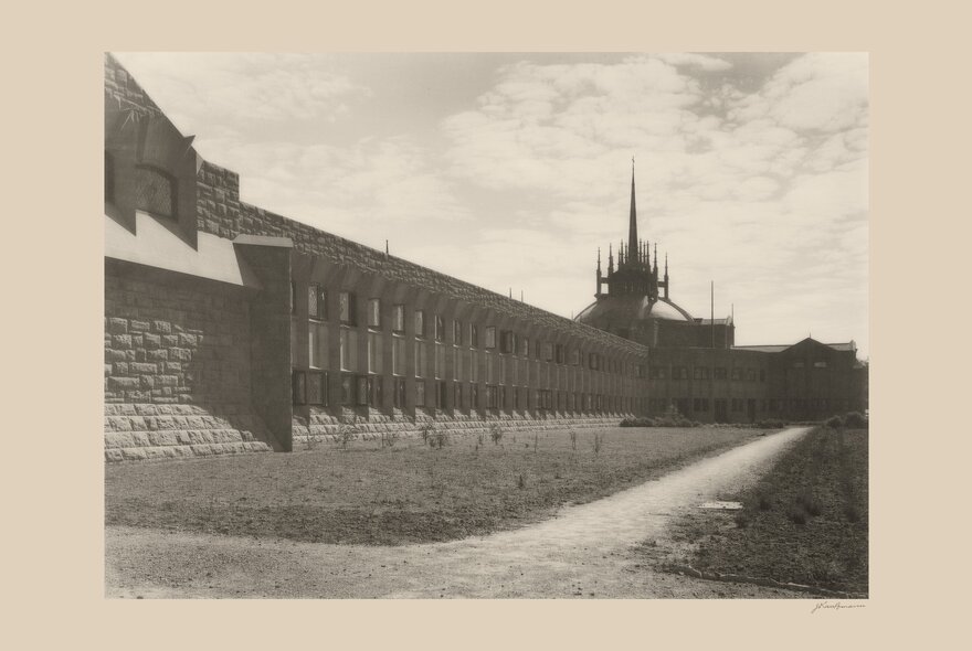 Historic black and white image of Newman College at the University of Melbourne, designed by architect Walter Burley Griffin and completed in 1918.