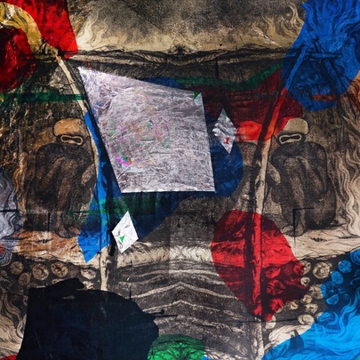 A mixed-media artwork that features a dense, multi-layered composition in shades of red, blue, white and black that blends archival imagery, figures and contemporary abstract marks.