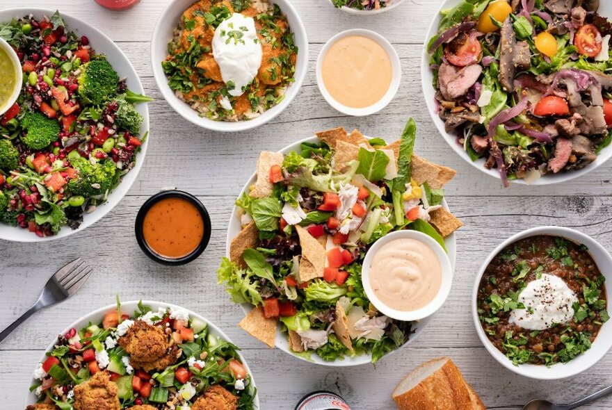 A table covered in colourful salads.