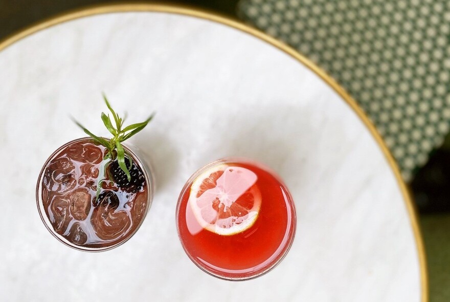 Two drinks on a small table.