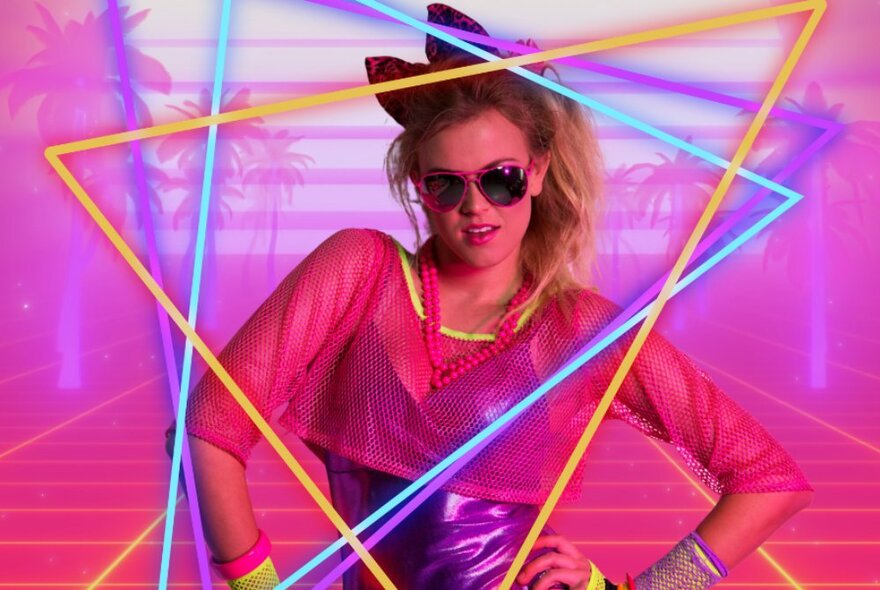 Dancer dressed in pink top, sunglasses and jewellery inspired by the 1980s and Madonna.