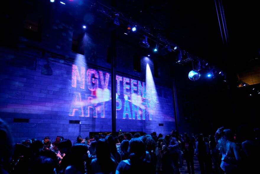 Night venue with signage and spotlights.