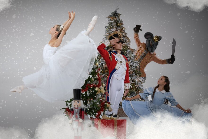 Four ballet performers in costume from The Nutcracker posed around a decorated Christmas tree with low-lying fog and falling snow.