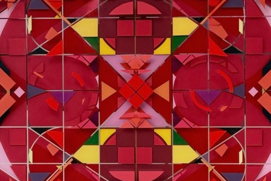 A kaleidoscope image in red tones. 