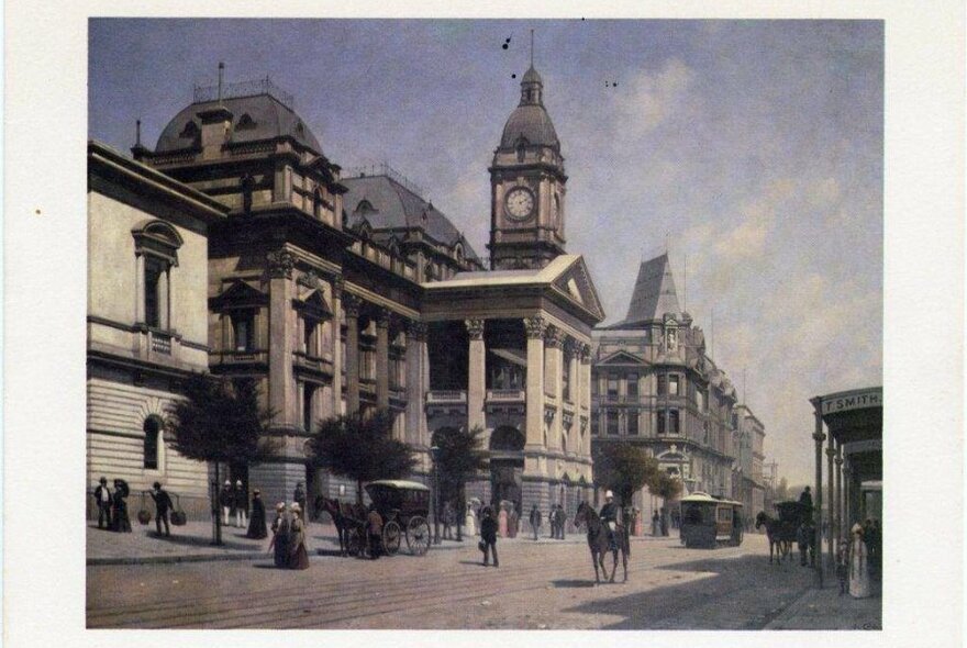 An old photo of a government building on a dirt road