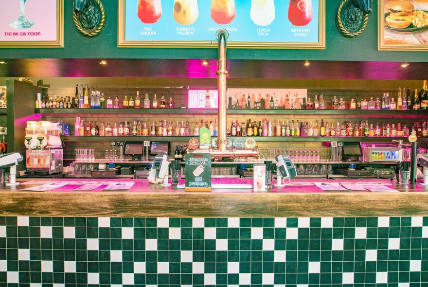 Bar with many bottles of alcohol on the shelves.