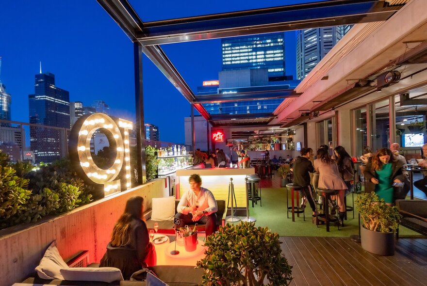 A rooftop bar at night 