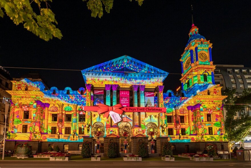 Melbourne Town Hall lit up with Christmas projection lights. 