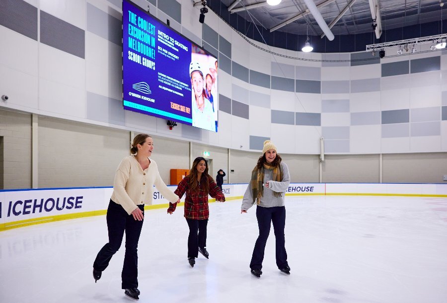 Three girls ice skating