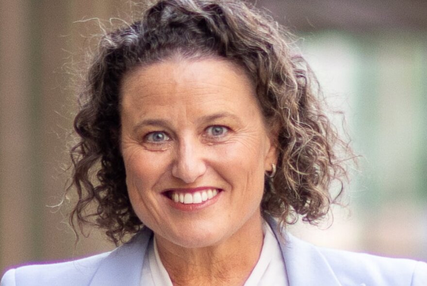 A smiling headshot of Dr Kirstin Ferguson.