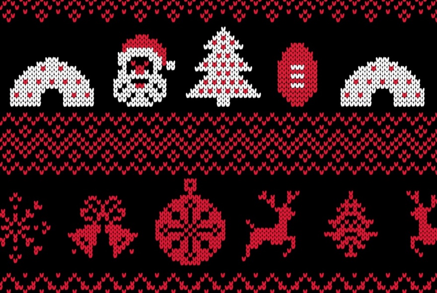 A knitted decorative Christmas pattern of Santa faces, a Christmas tree, bells, a reindeer and other symbols.