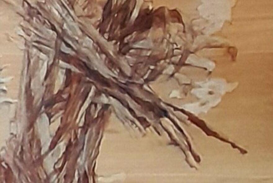 Abstract artwork in ochres and browns.