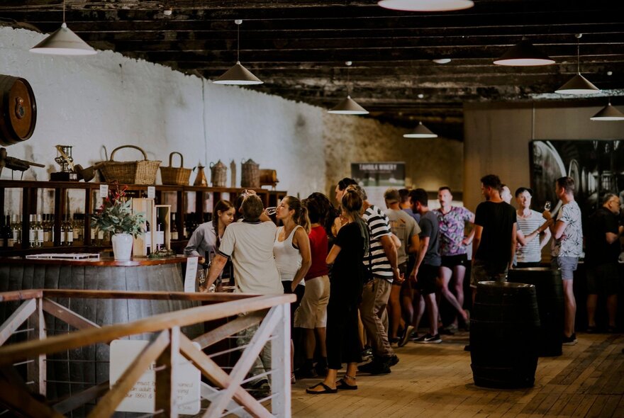 Visitors at the Tahbilk Winery Cellar Door, sampling wines.