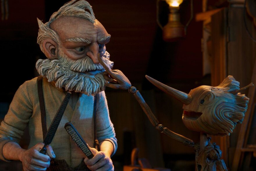 Puppets on the a Pinocchio film set showing Geppetto and Pinocchio. 
