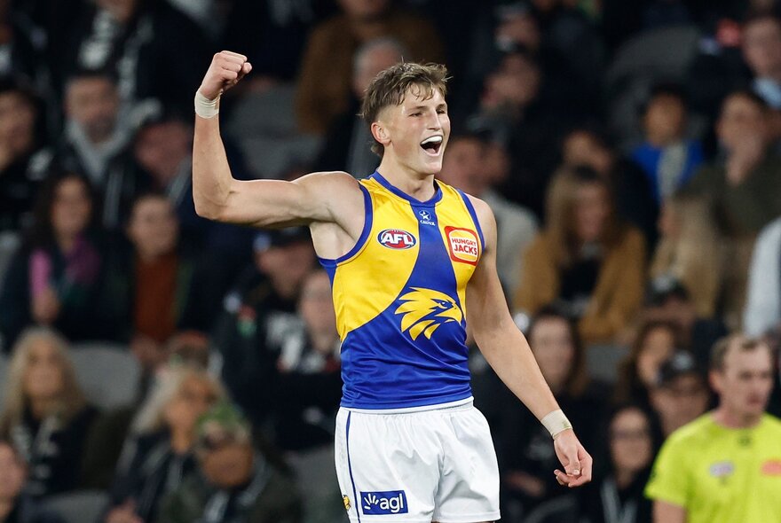 West Coast AFL football player making a fist during a match.