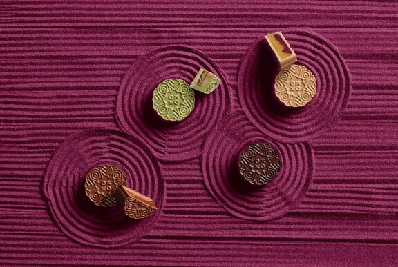 Four mooncakes in different colours.