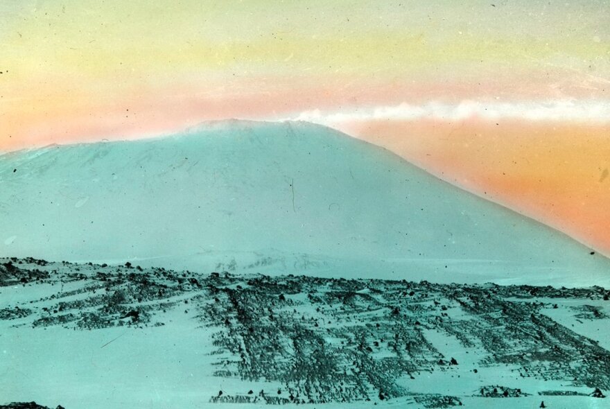 Graphic print of ice-covered hill with orange sky.