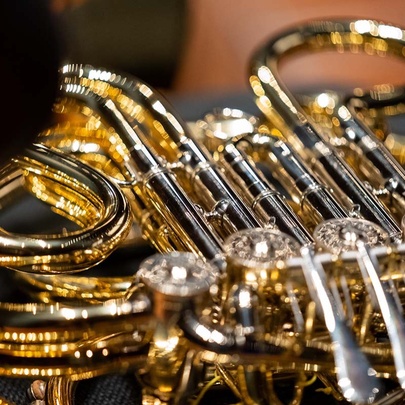 A close up image of a brass instrument. 