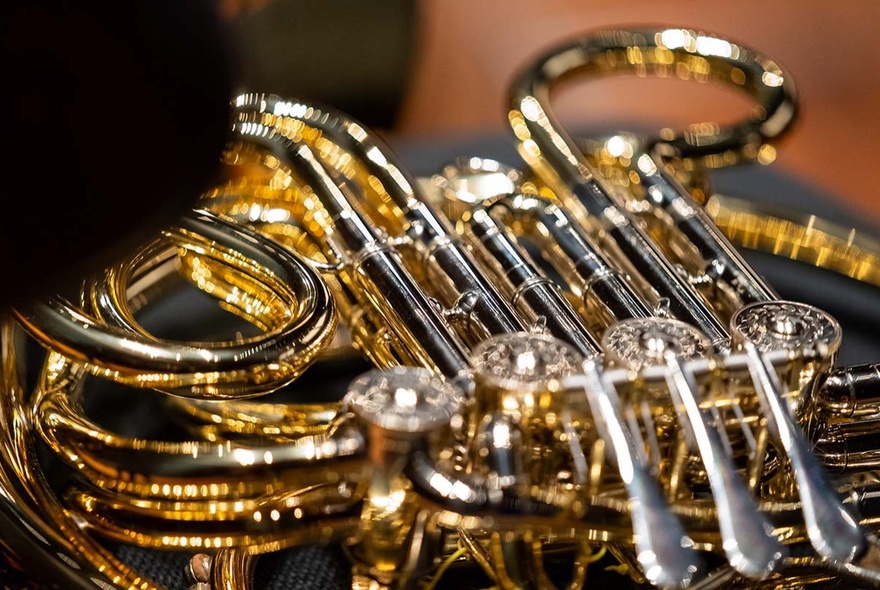 A close up image of a brass instrument. 