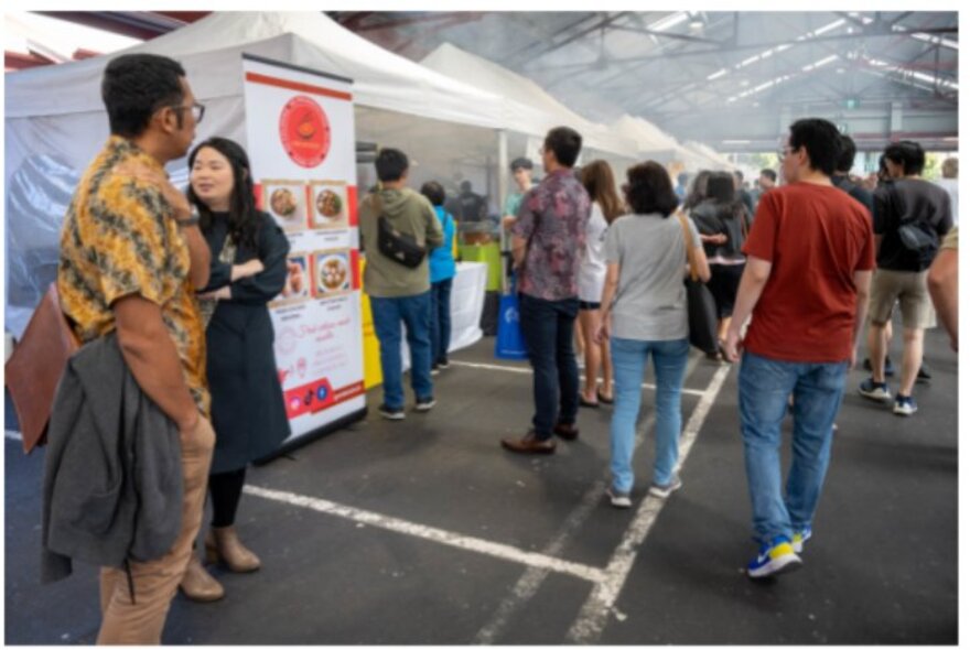 People walking around and looking at stalls at the Indonesian Street Food Festival at Queen Victoria Market.